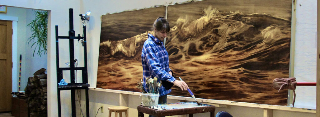 Realist landscape artist Lorena Pugh painting large wave